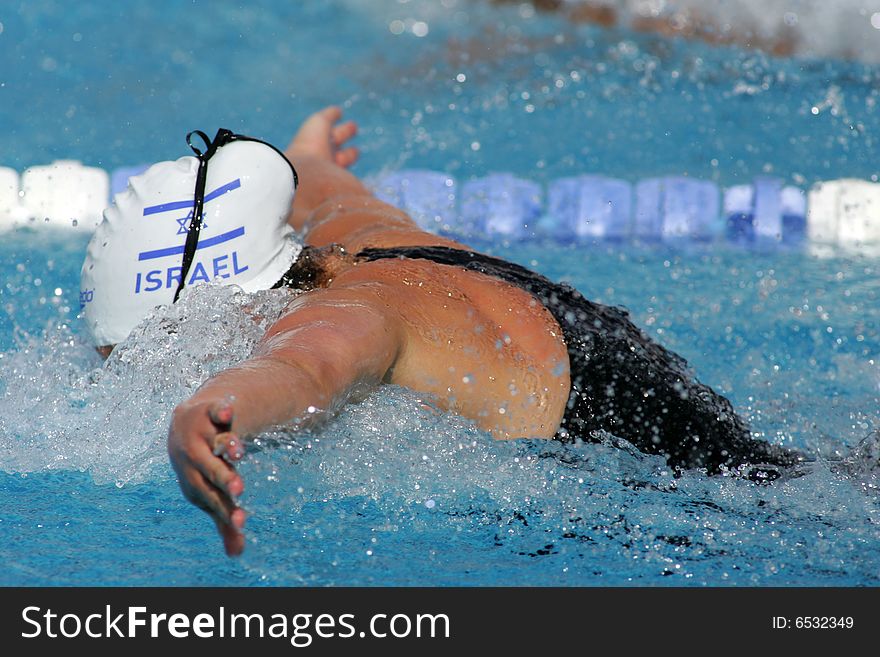 Powerful female swimmer swimming butterfly stroke