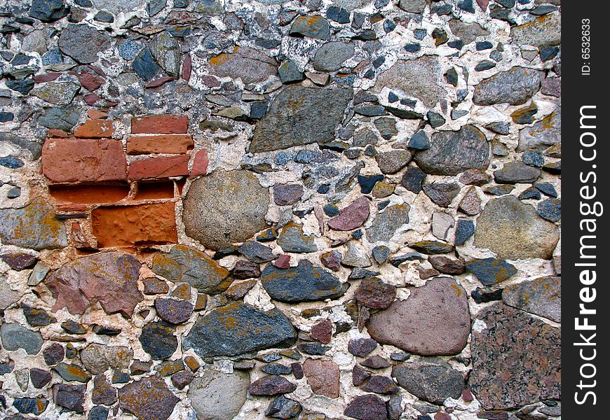 Old grey wall made of stones. Old grey wall made of stones