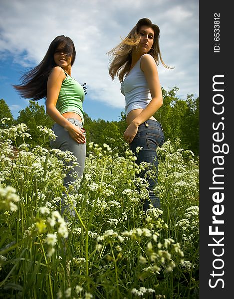 Two girls on a  meadow