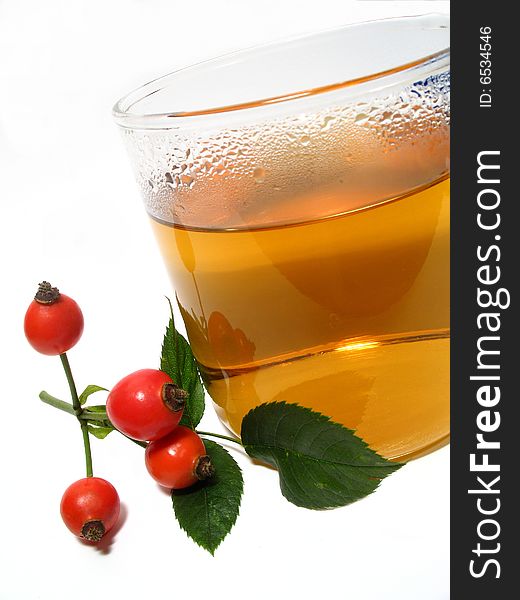 Detail of hip rose and tea in glass. Detail of hip rose and tea in glass