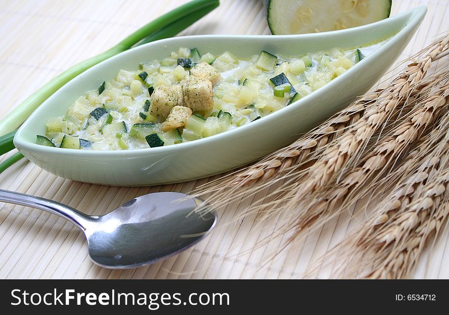 A fresh stew of zucchini with croutons