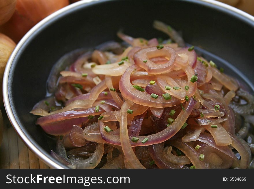 A fresh soup of red onions in a pan. A fresh soup of red onions in a pan