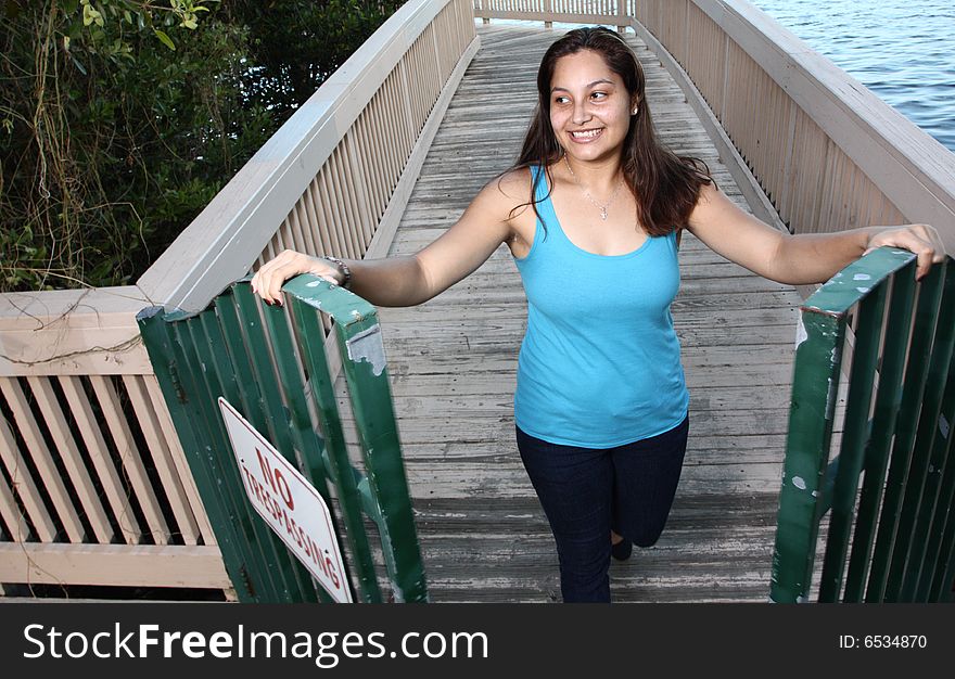 Woman walking through a gate.