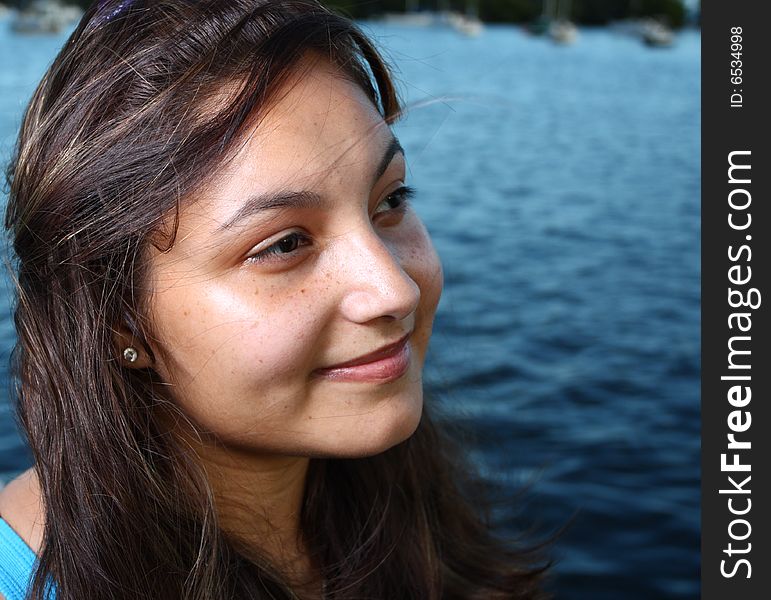 Young woman smiling while looking sideways