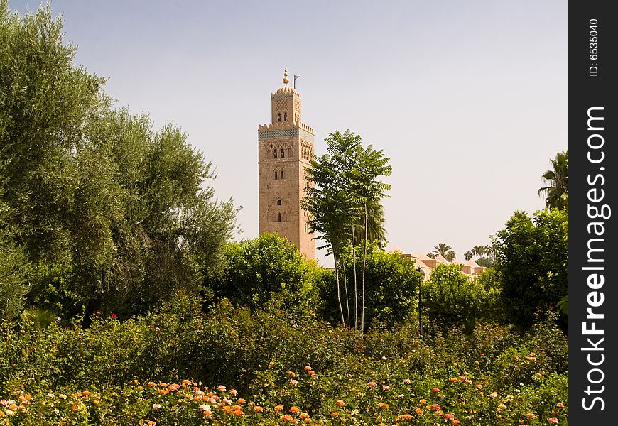 Green park and in background Koutoubia mosque. Marocco, Marrakesh