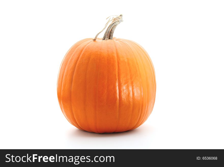 Big round orange pumpkin isolated on white