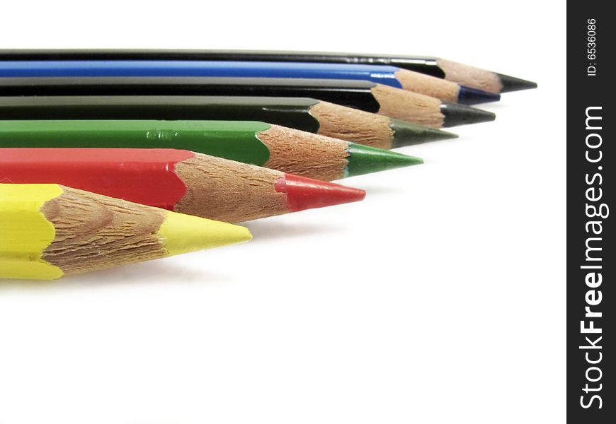 Closeup of color pencils in white background.