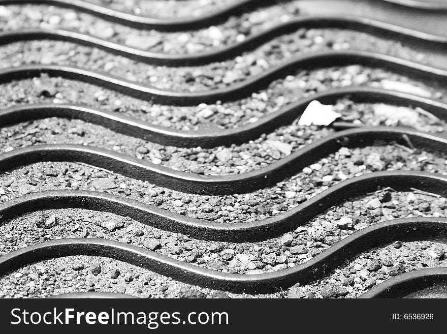 The waves on a manhole cover. The waves on a manhole cover