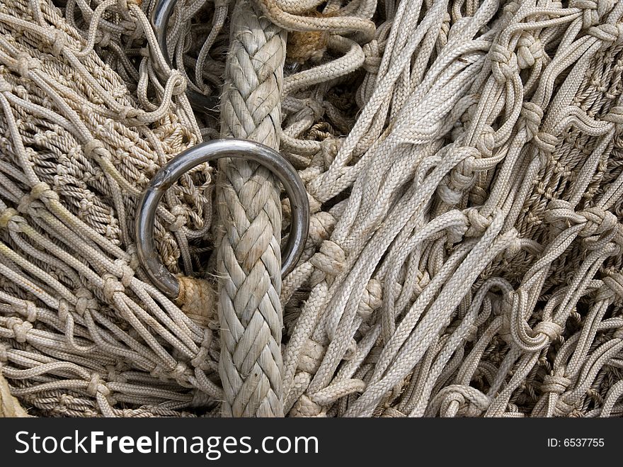 Close up of the lead rope of a comercial fishing net. Different size of netting