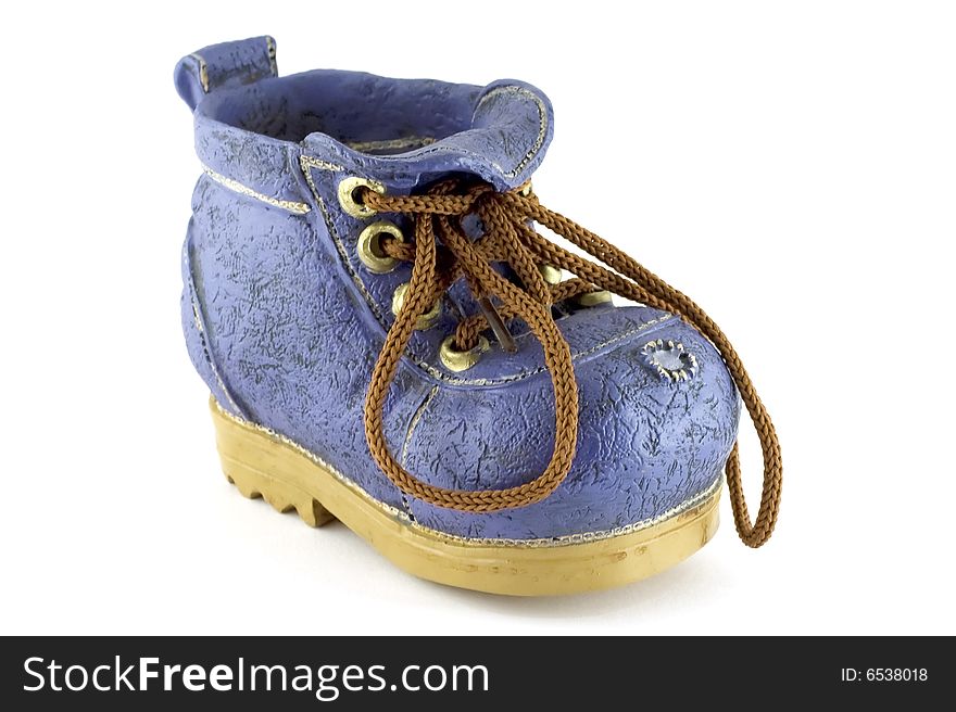 Isolated blue clay toy shoe on white background