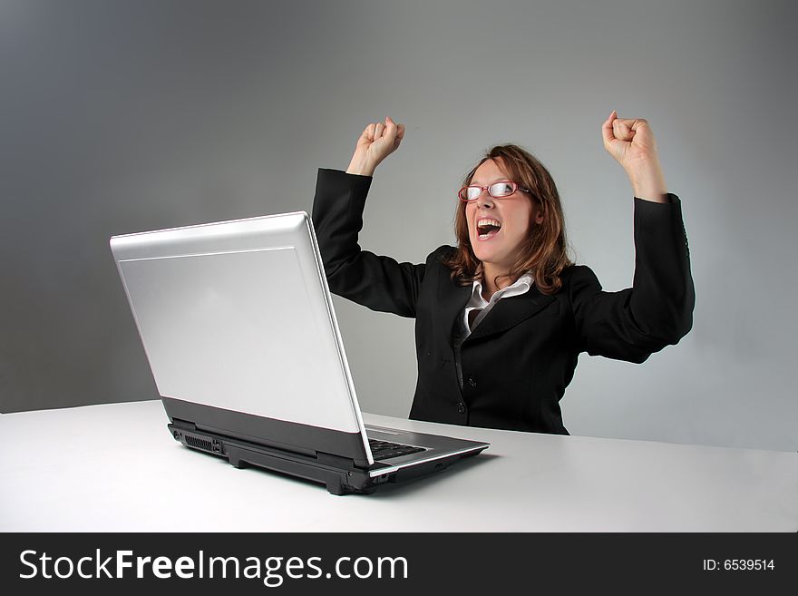 Happy business woman at computer. Happy business woman at computer