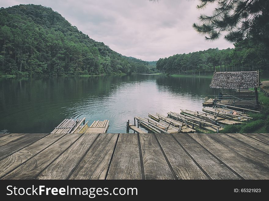 Wooden floor with lake landscape. vintage stylization