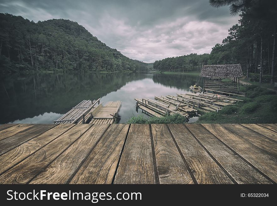 Wooden floor with lake landscape. vintage stylization