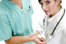 Young Nurse Checking Pulse Of Patient Royalty Free Stock Photo Young Nurse Checking Pulse Of Patient Royalty Free Stock Photo