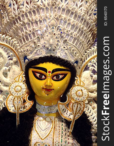 According to the Indian Mythology a decorated clay Sculptures of ten handed goddess Durga during the annual autumnal Durga Puja (worship) festival of India. According to the Indian Mythology a decorated clay Sculptures of ten handed goddess Durga during the annual autumnal Durga Puja (worship) festival of India.