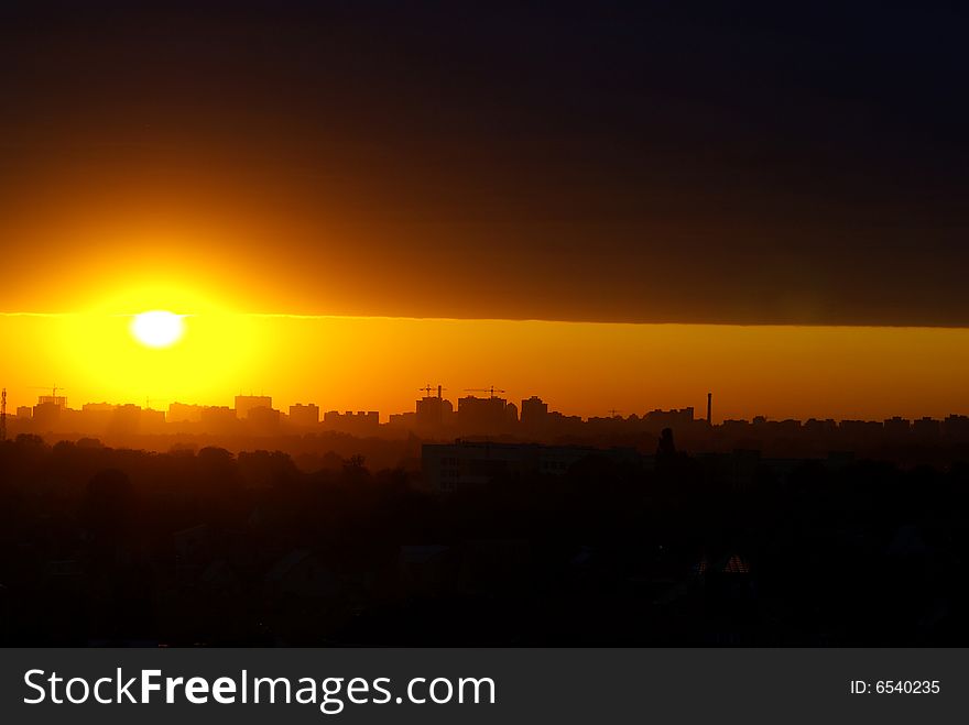 Evening sunset above modern city. Evening sunset above modern city