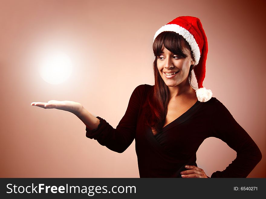 Portrait of woman wearing santa claus hat on red. Portrait of woman wearing santa claus hat on red