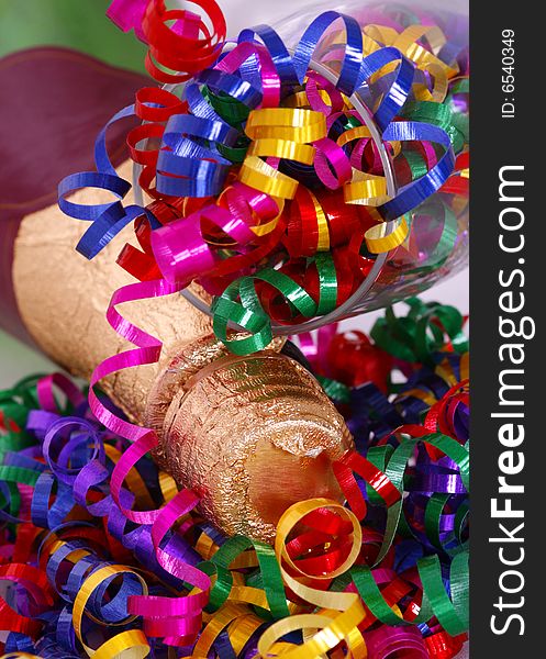 Bottel with glass and colorful ribbons in celebration of New Year's. Bottel with glass and colorful ribbons in celebration of New Year's