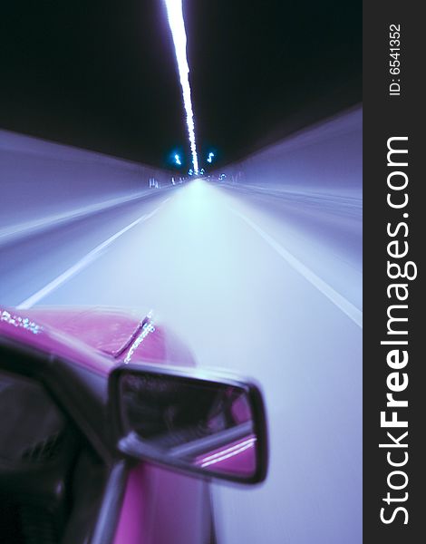 High speed car in a tunnel - abstract blue colors