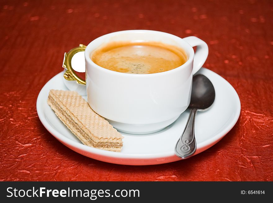 Coffee espresso with wafer cookies, on deep red background