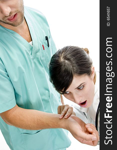 Nurse checking pulse of patient on an isolated background