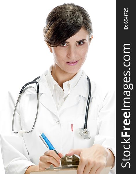 Beautiful doctor posing with writing pad and pen on an isolated background