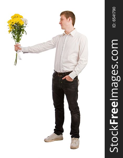 Man gives yellow flowers on white background