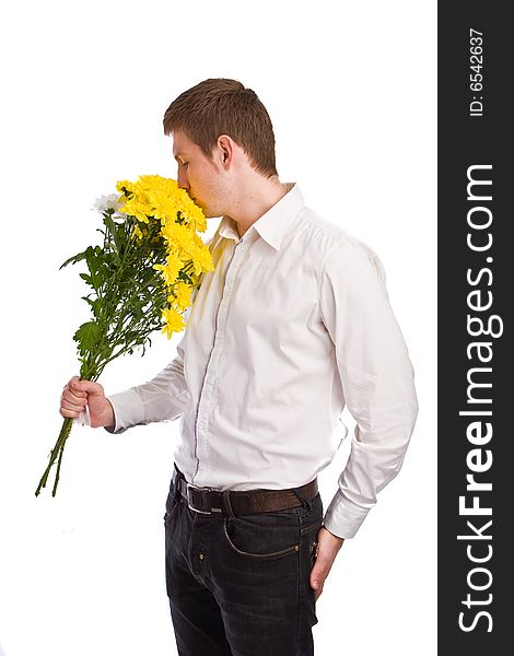 The man with a bouquet yellow flowers waits the girlfriend. The man with a bouquet yellow flowers waits the girlfriend