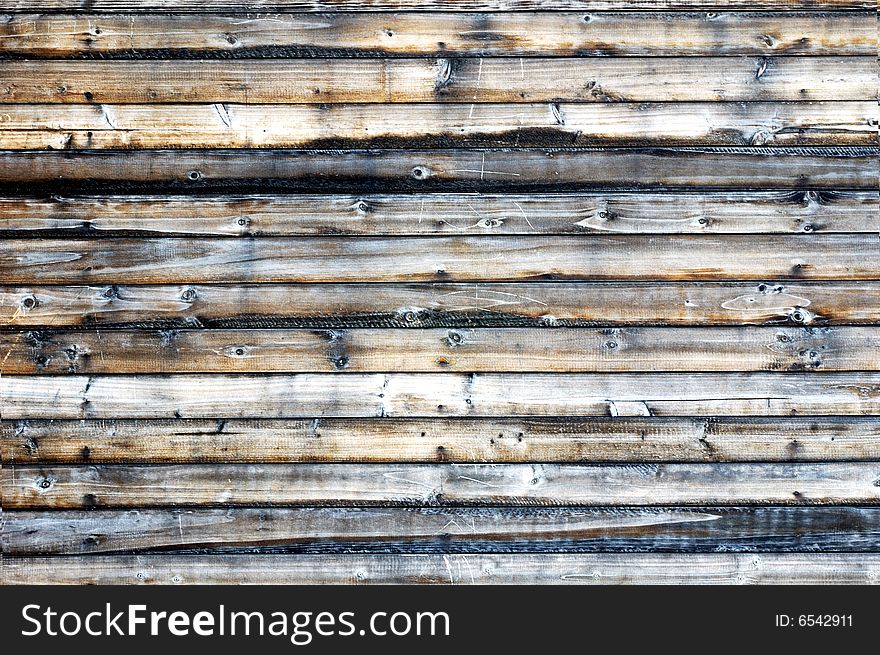 Wall consist of wooden boards. Wall consist of wooden boards