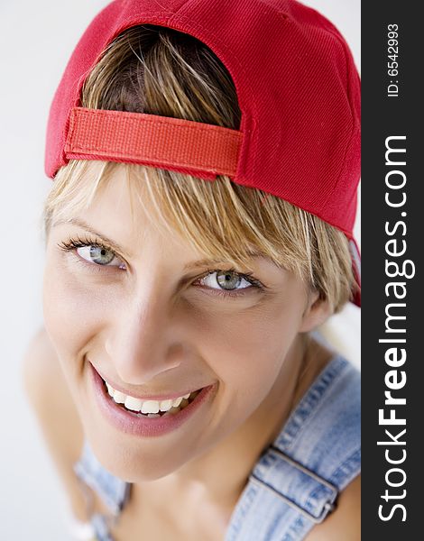 Closeup portrait of young woman with baseball cap. Closeup portrait of young woman with baseball cap