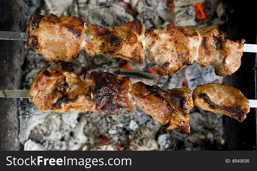 Shish kebab prepared on barbecue