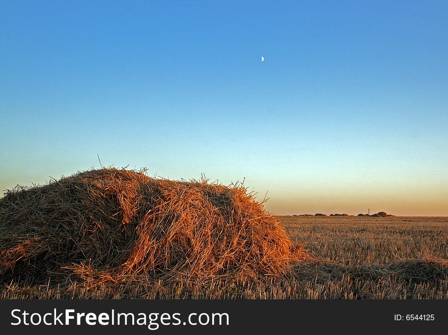 Haystack against the evening sky