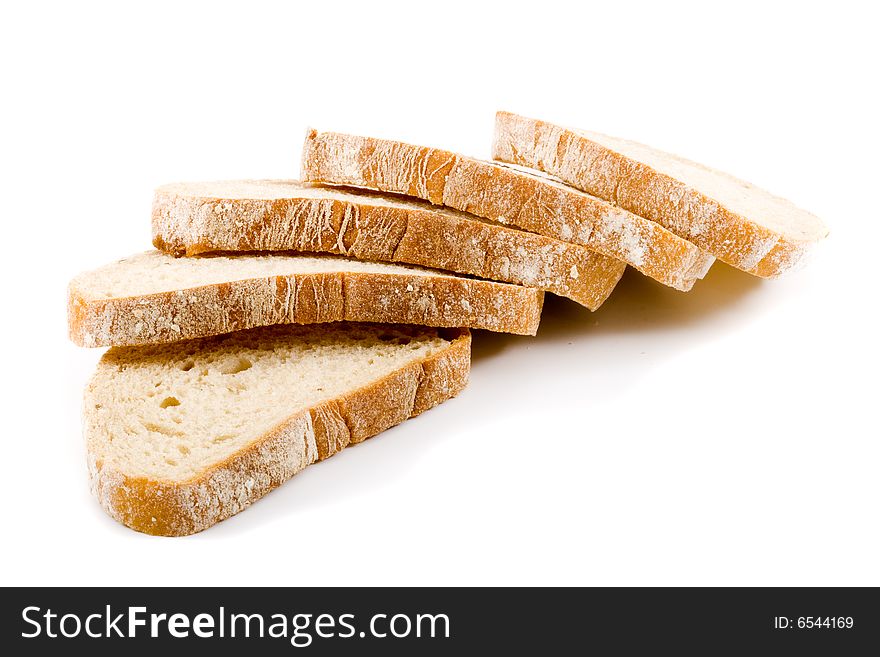 Five slices of white bread on the white background