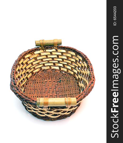 Close up of the wicker basket isolated on the white background.