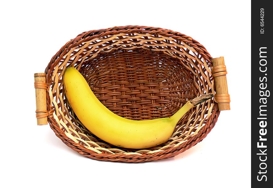 Banana in the wicker basket isolated on the white background. Banana in the wicker basket isolated on the white background.