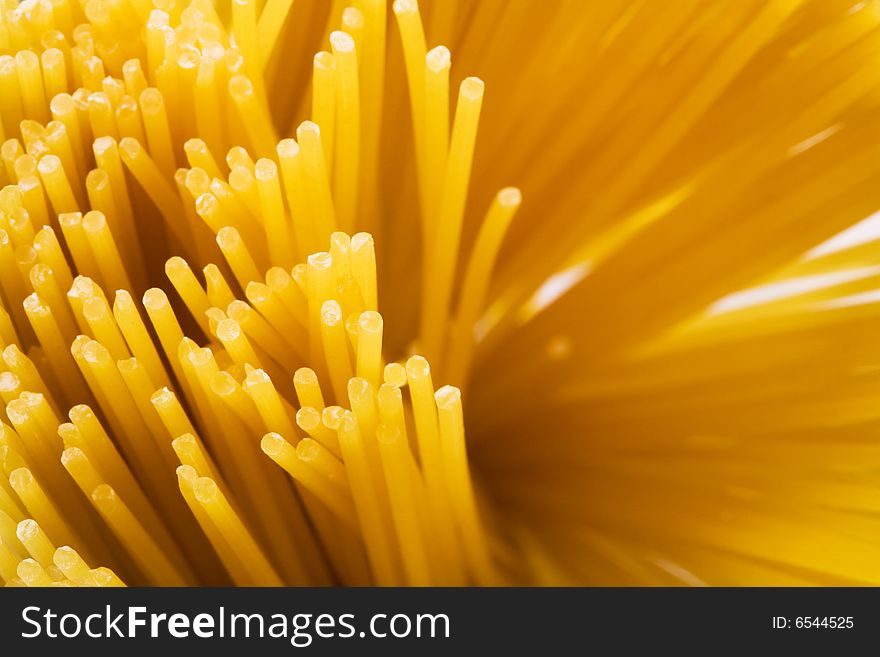Yellow and beautiful pasta close-up as a background