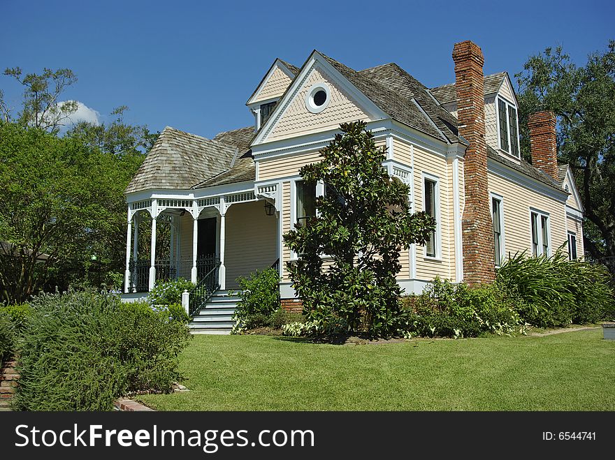 A cute peach colored victorian styel house. A cute peach colored victorian styel house