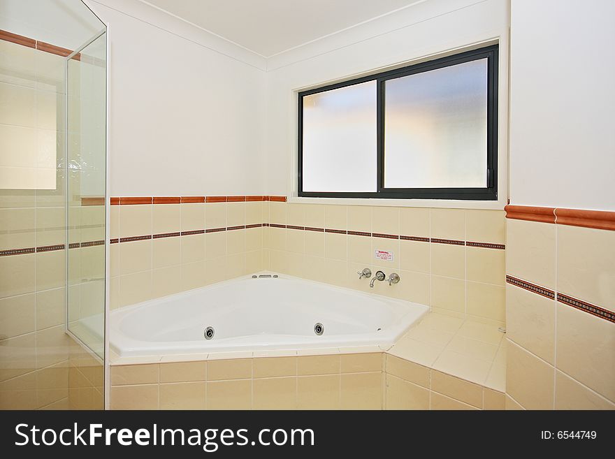 An interior photo of a modern bathroom. An interior photo of a modern bathroom