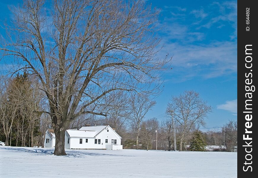 A Winter scene with an old farmhouse in Thompson Grove Park in Holmdel, New Jersey. A Winter scene with an old farmhouse in Thompson Grove Park in Holmdel, New Jersey.