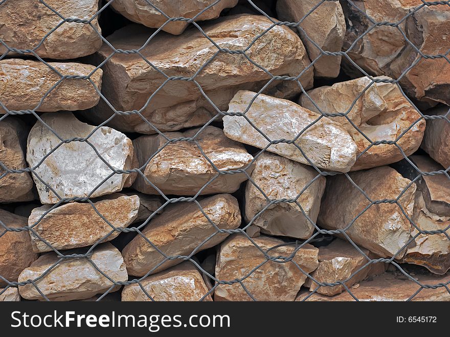 Stones under the metal net