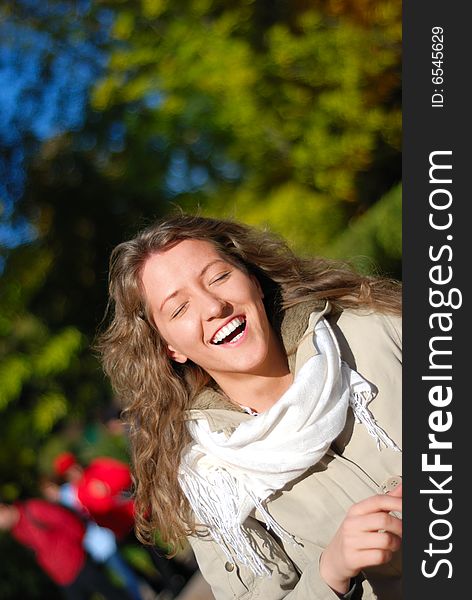 Young fresh smiling woman in autumn