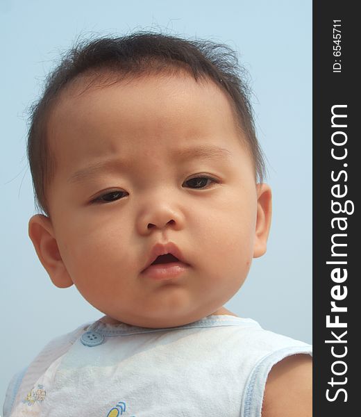 Lovely baby and blue sky on the roof. Lovely baby and blue sky on the roof