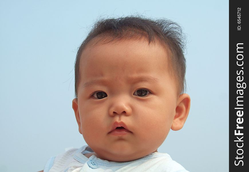 Lovely baby and blue sky on the roof. Lovely baby and blue sky on the roof