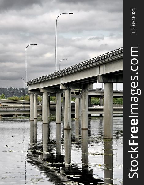Interstate overpass over water with reflection. Interstate overpass over water with reflection