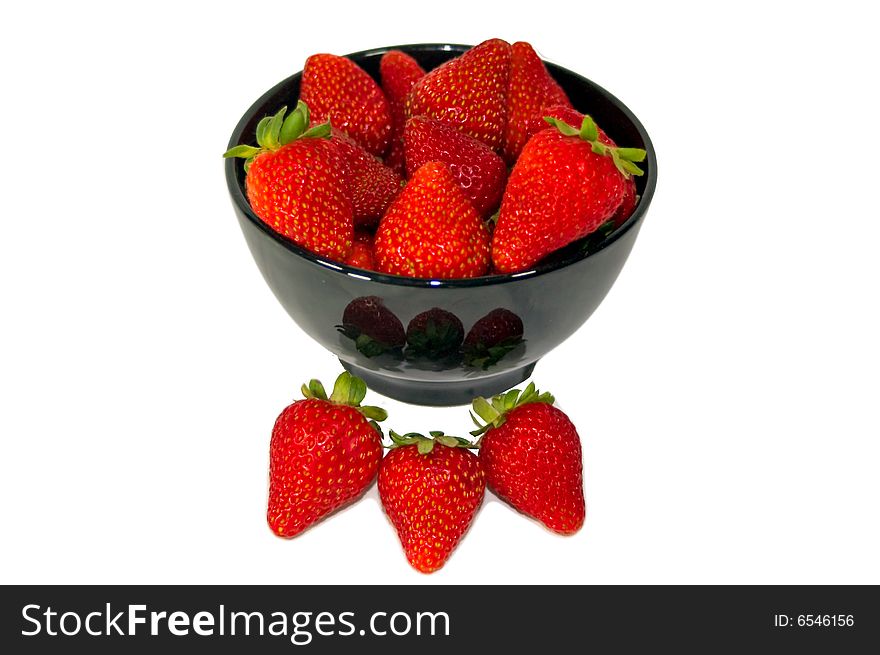 A bowl of bright red strawberries. A bowl of bright red strawberries