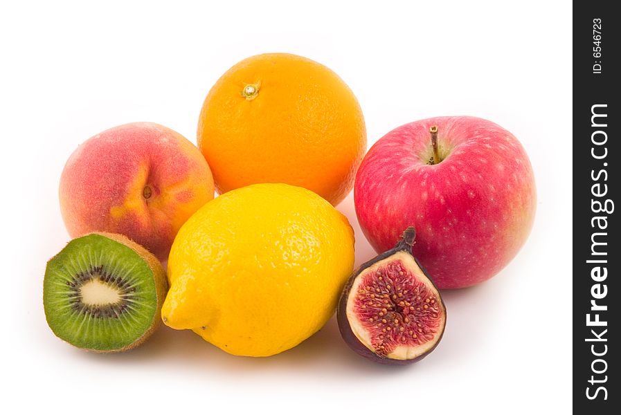 Beautiful peach apple fig lemon orange tasty and useful fruit on white background