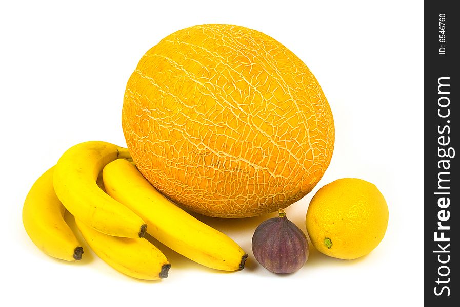 Fig bananas ripe tasty melon and yellow fruit with lemon on white background
