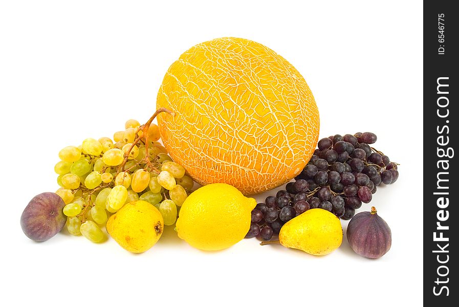 Many tasty fruits grapes of pear fig lemon melon on white background