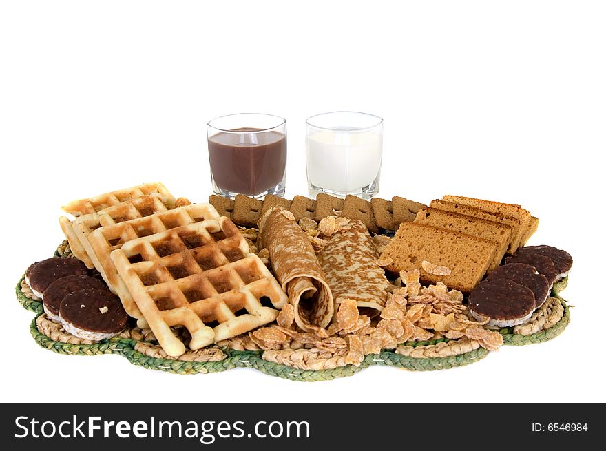 Variety of sweets with milk on white background. Variety of sweets with milk on white background