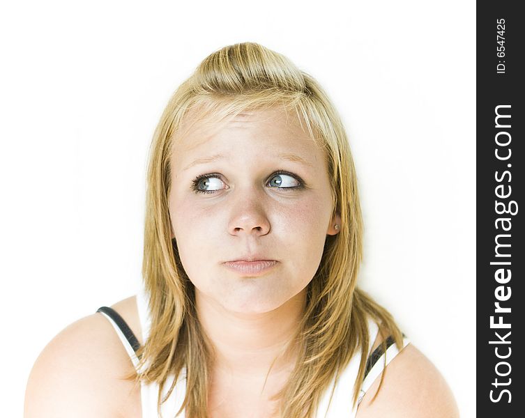 Young teenage girl looking to her right with a sad expression. Isolated on white background. See my portfolio for other expressions in this series. Young teenage girl looking to her right with a sad expression. Isolated on white background. See my portfolio for other expressions in this series.